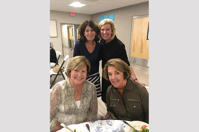 Jane Dooner, Mary Ann Bond, Meg Spence, & Chris Ostrander share a table at the new member’s luncheon.
